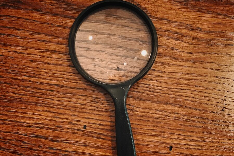 black framed magnifying glass